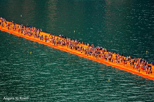 Visitors on the walkway, Christo's Floating Piers and the turquoise-colored water of Lake Iseo, Sulzano, Brescia - Lombardy