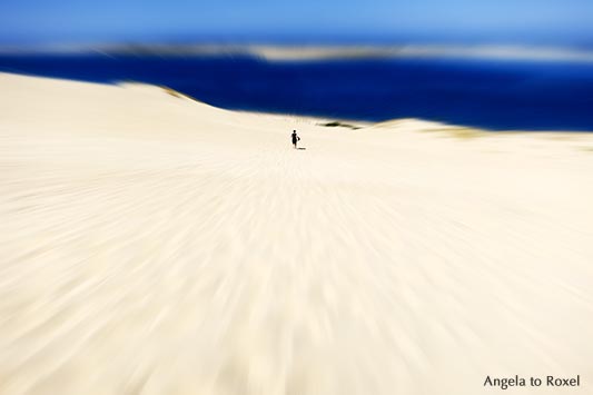 Woman running down Dune du Pilat, blur, La Teste-de-Buch, Arcachon, Nouvelle-Aquitaine, France 2012